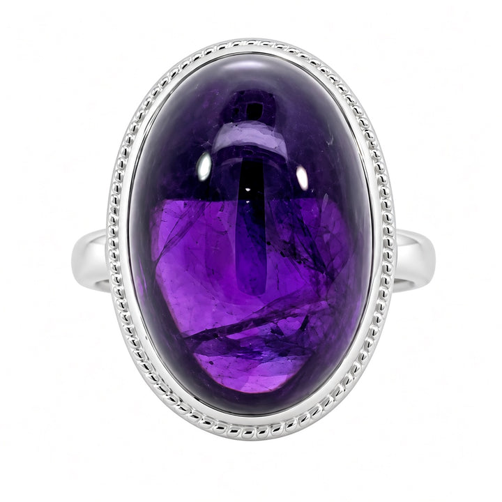 14K white gold amethyst solitaire ring featuring a large 12.07CT polished purple cabochon amethyst gemstone.
