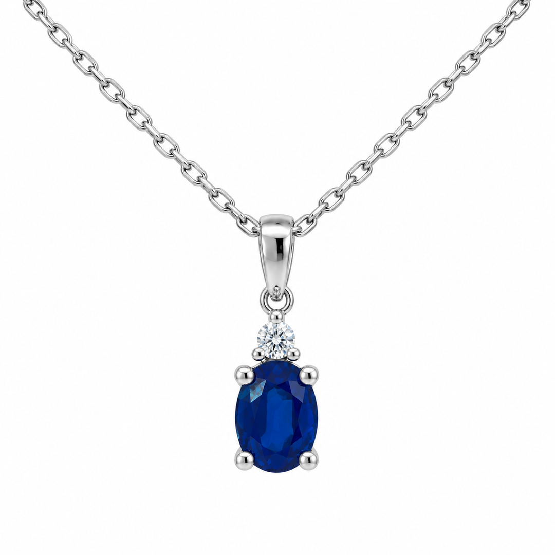 14K white gold natural oval blue sapphire and diamond pendant featuring 1.00CT gemstone weight with sparkling diamond accents.