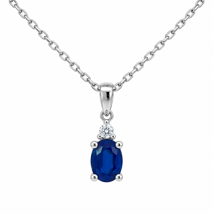14K white gold natural oval blue sapphire and diamond pendant featuring 1.00CT gemstone weight with sparkling diamond accents.