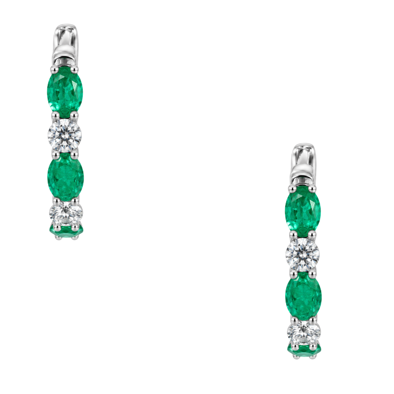 14K white gold emerald and diamond hoop earrings featuring natural oval emeralds and sparkling diamonds totaling 1.30CTW.