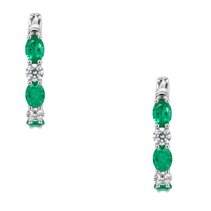 14K white gold emerald and diamond hoop earrings featuring natural oval emeralds and sparkling diamonds totaling 1.30CTW.