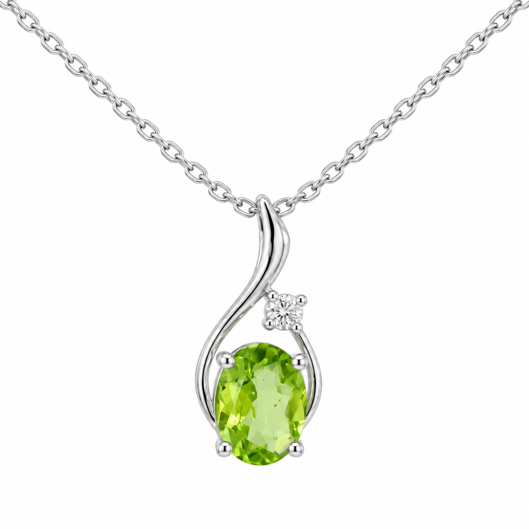 14K white gold peridot and diamond swirl pendant featuring a 1.00CT natural oval peridot accented by sparkling diamonds.