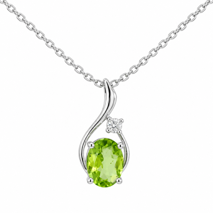 14K white gold peridot and diamond swirl pendant featuring a 1.00CT natural oval peridot accented by sparkling diamonds.