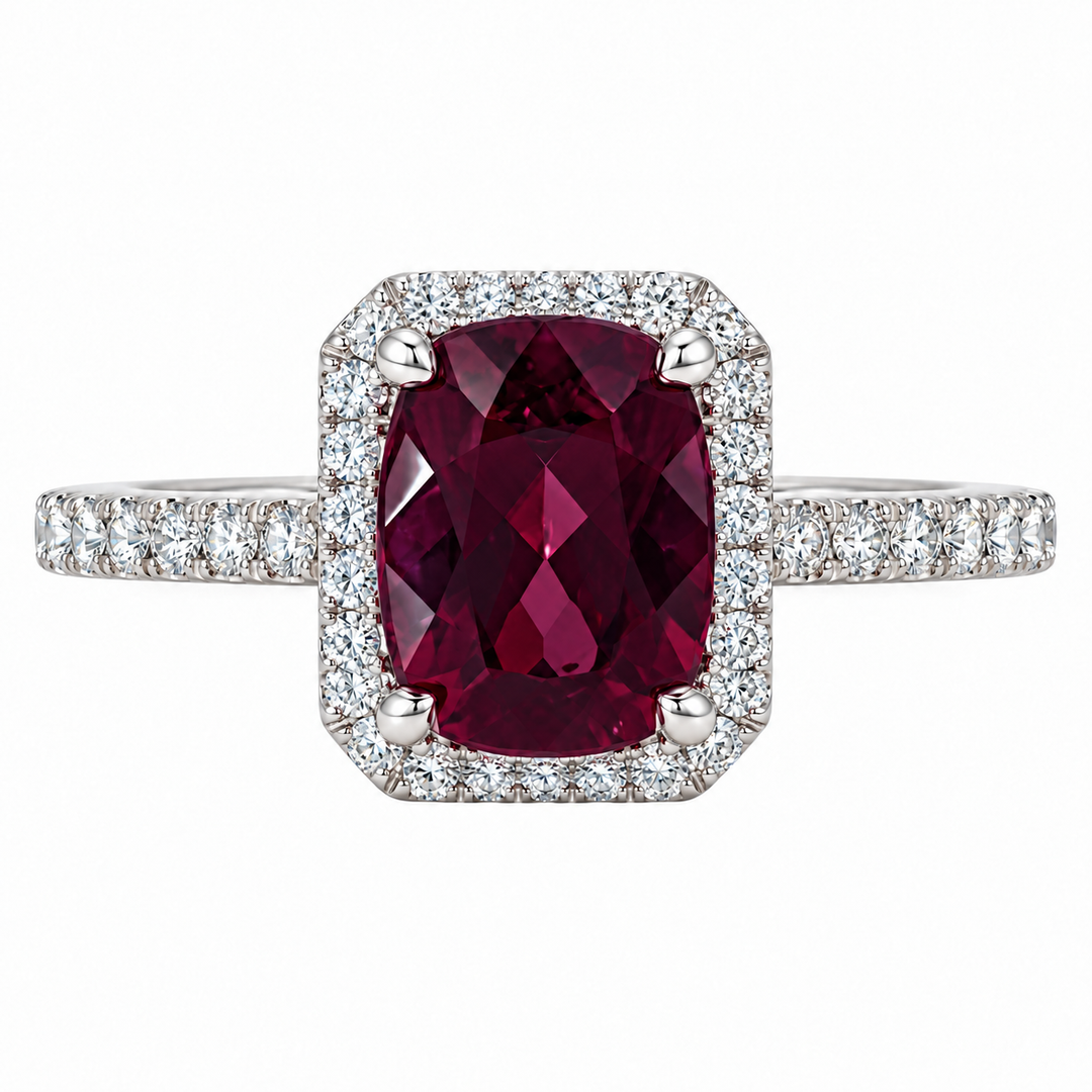 14K white gold rhodolite garnet and diamond halo ring featuring a 2.54CT garnet surrounded by sparkling diamond accents.