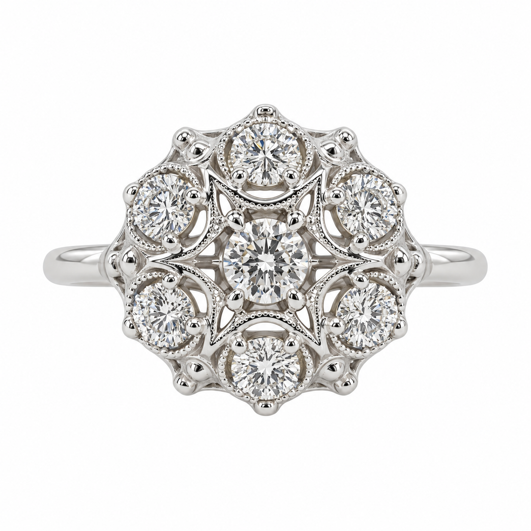 Vintage 14K white gold diamond cluster ring featuring 0.84CTW diamonds in an elegant, antique-inspired cluster design.