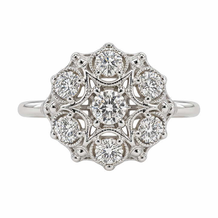 Vintage 14K white gold diamond cluster ring featuring 0.84CTW diamonds in an elegant, antique-inspired cluster design.