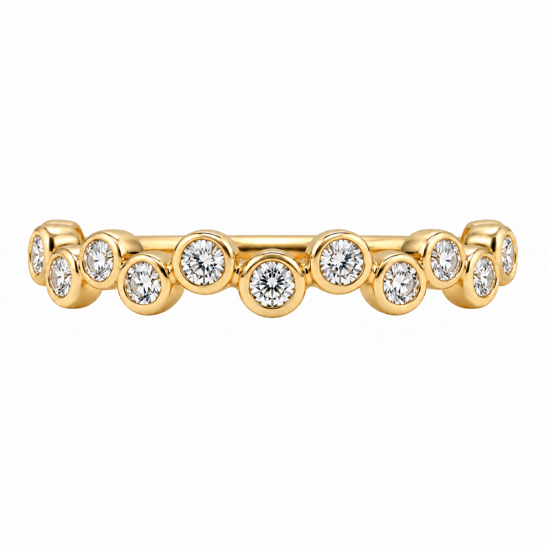 14K yellow gold bubble diamond band featuring 0.32CTW bezel set diamonds in a modern, delicate stacking ring design.