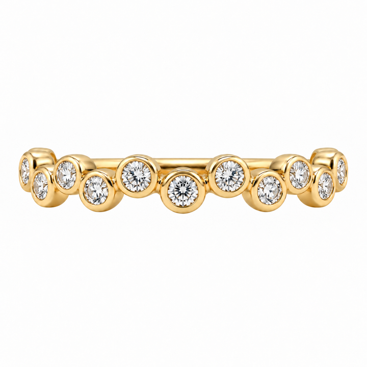14K yellow gold bubble diamond band featuring 0.32CTW bezel set diamonds in a modern, delicate stacking ring design.