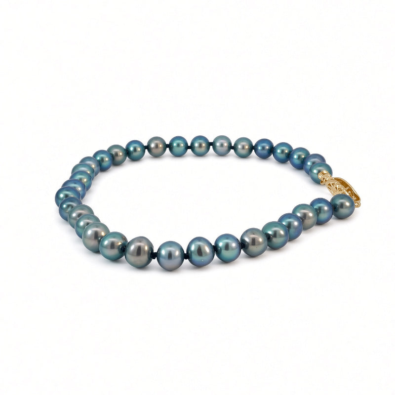 A strand of round Tahitian blue-gray pearls with a gold clasp