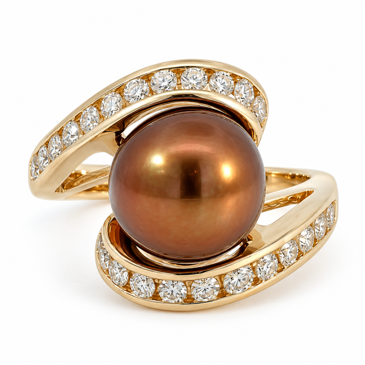 Elegant 14K yellow gold bypass ring featuring a 10.5MM brown pearl and 0.25CT diamonds. A graceful design with soft luster and refined sparkle.