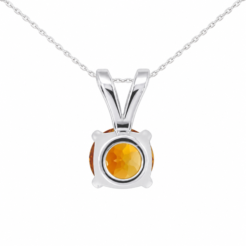 A silver pendant necklace featuring a round faceted orange gemstone in a prong setting