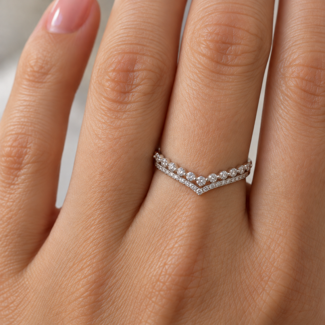 14K white gold diamond wedding band features a double-row chevron design with 0.54 carats of round diamonds. The graceful V-shaped silhouette 