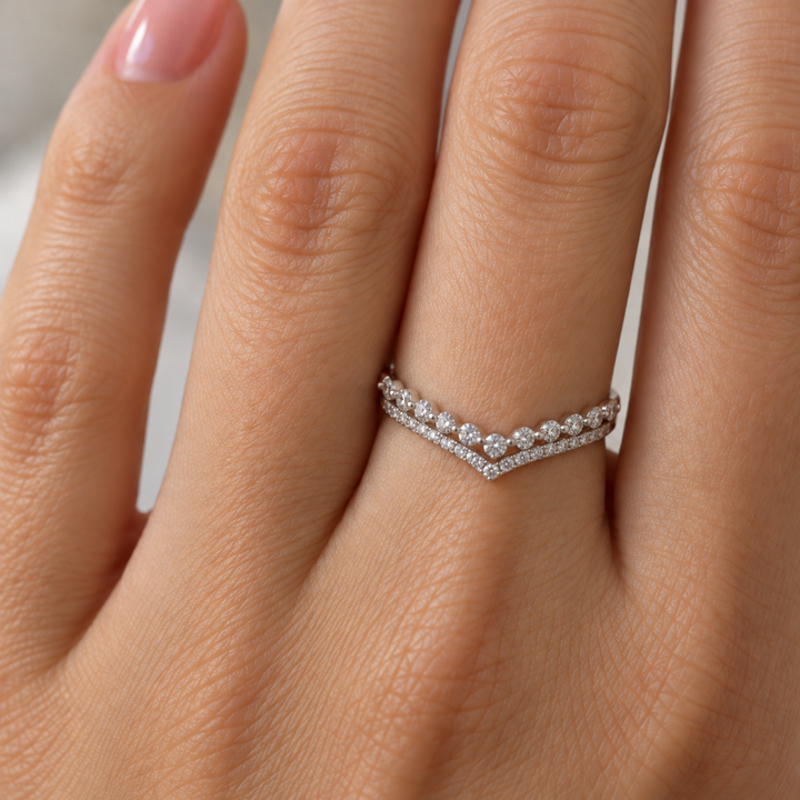  14K white gold diamond wedding band features a double-row chevron design with 0.54 carats of round diamonds. The graceful V-shaped silhouette 