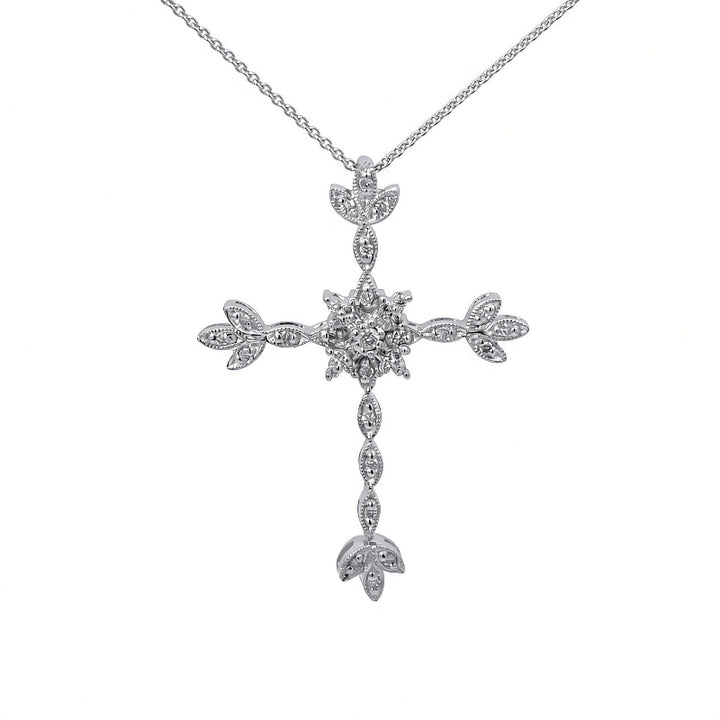 A silver cross pendant necklace adorned with small clear stones