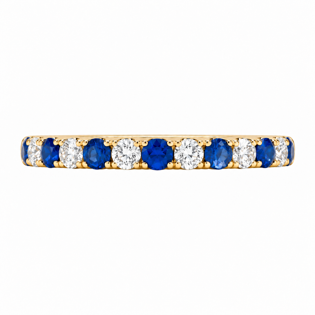 Shop this 14K yellow gold sapphire and diamond wedding band featuring 0.59CTW gemstones. A beautiful stackable ring perfect for bridal sets or everyday wear.