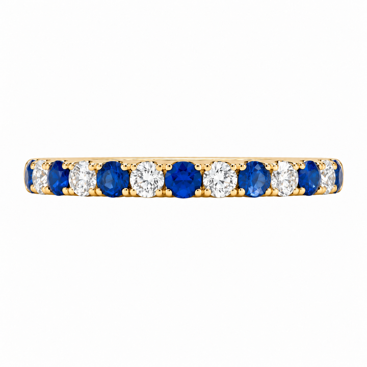 Shop this 14K yellow gold sapphire and diamond wedding band featuring 0.59CTW gemstones. A beautiful stackable ring perfect for bridal sets or everyday wear.