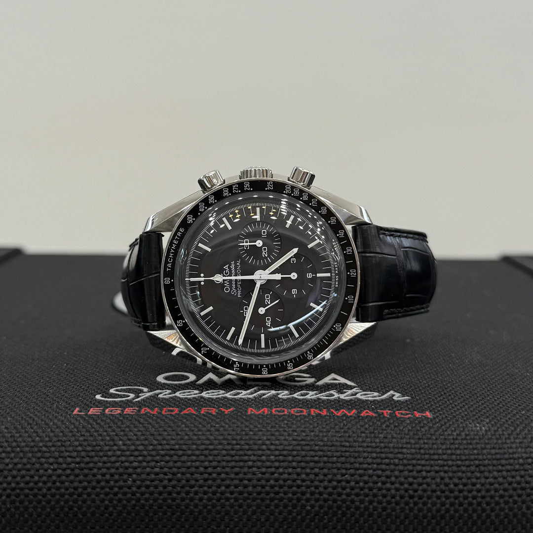 Omega Speedmaster watch on a branded display stand