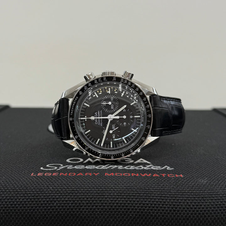 Omega Speedmaster watch on a branded display stand