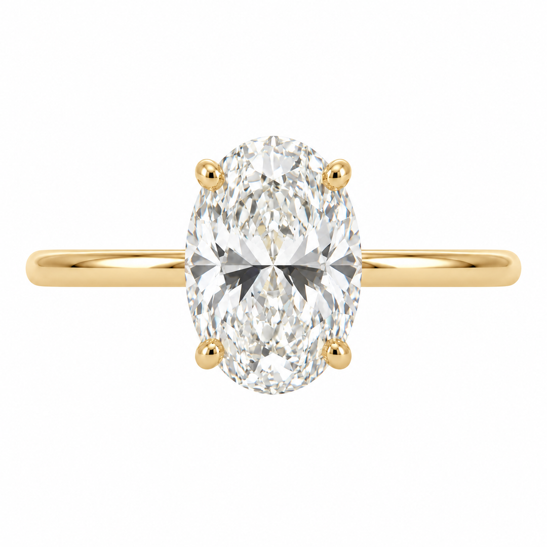 Covenant 14K yellow gold engagement ring featuring a 2.08CT oval lab grown diamond with a delicate hidden halo setting.