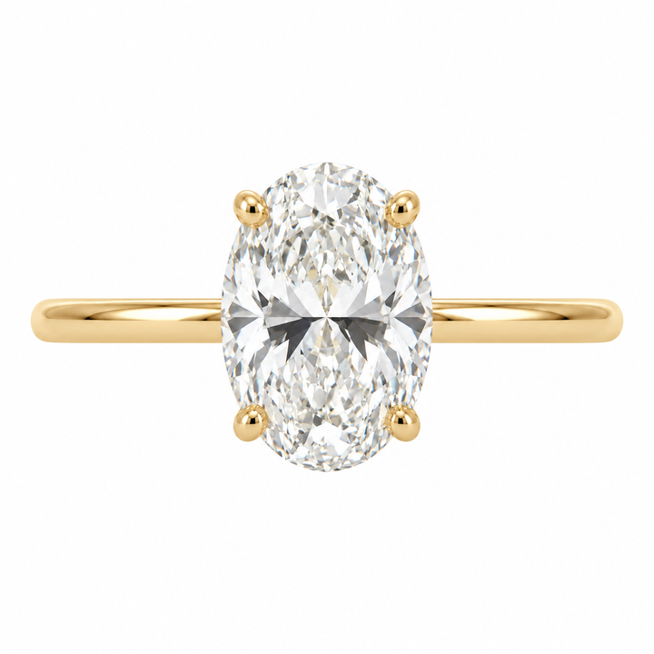 Covenant 14K yellow gold engagement ring featuring a 2.08CT oval lab grown diamond with a delicate hidden halo setting.
