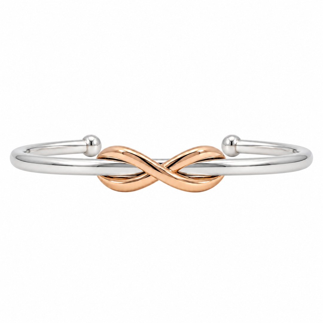 Tiffany &amp; Co. Infinity Knot cuff bracelet featuring an elegant intertwined knot design in 18K rose gold and sterling silver.