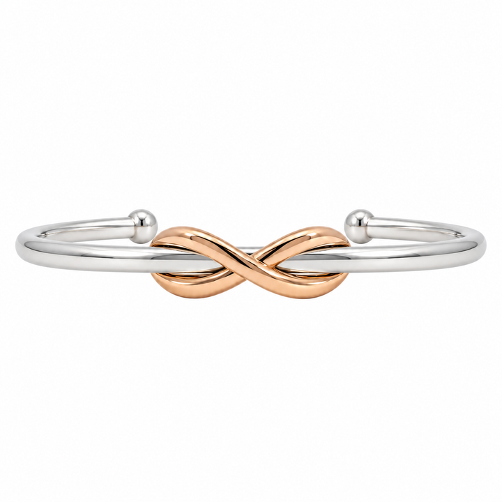Tiffany &amp; Co. Infinity Knot cuff bracelet featuring an elegant intertwined knot design in 18K rose gold and sterling silver.